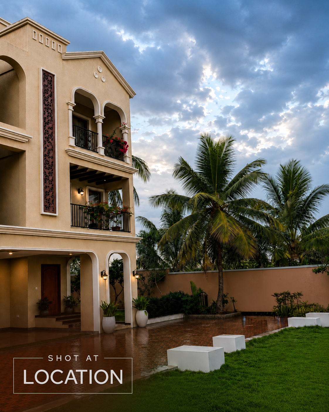 Project 3 Yelahanka Spanish-inspired villa facade with arched balconies at dusk